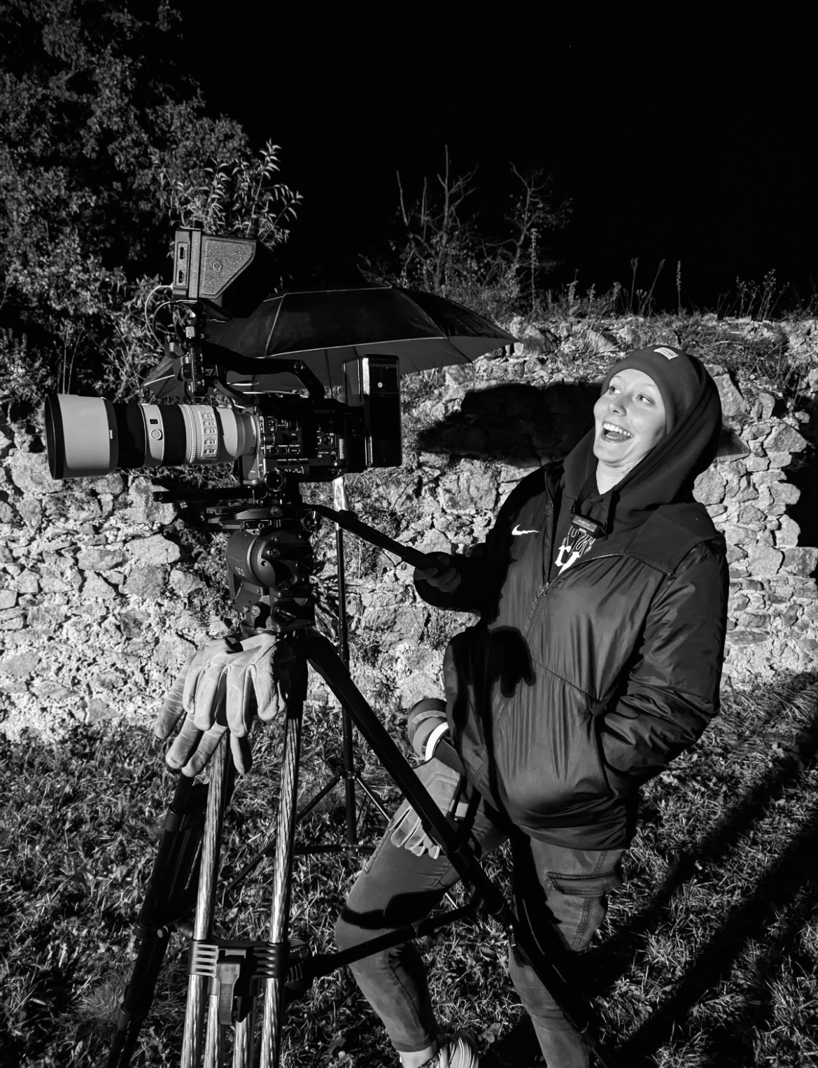 Anja working with a professional cinema camera on set